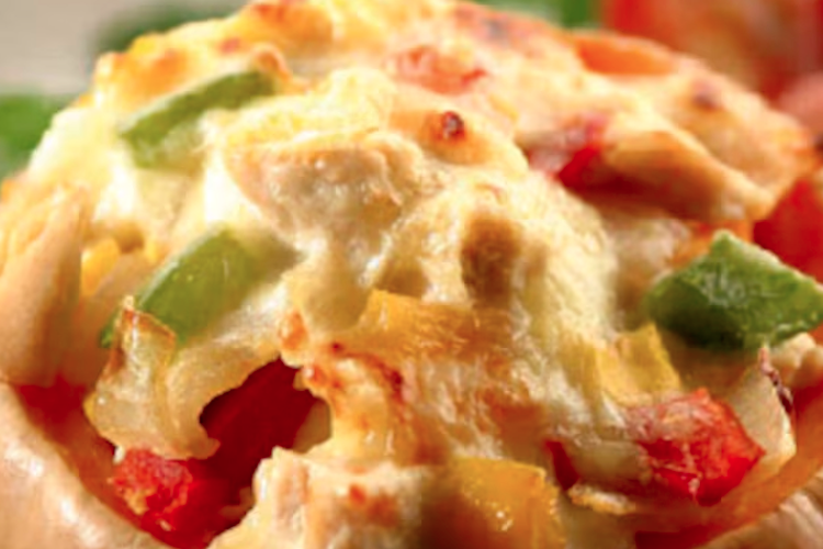 Calabazas rellenas de pollo y verduras, gratinadas con queso